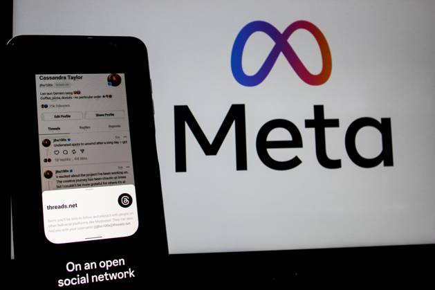 July 7, 2023, Bandung, West Java, Indonesia: In this photo illustration, Threads logo seen displayed on a smartphone and a Meta logo in the background. Threads is the new social network from Meta Platforms which was launched on the 5th of July 2023. According to Meta CEO Mark Zuckerberg, the Threads app is designed to rival Twitter. As of 6th of July 2023, the Thread app already has 10 million users. Bandung Indonesia - ZUMAs281 20230707_zip_s281_012 Copyright: xAlgixFebrixSugitax