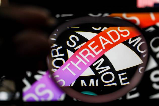 July 7, 2023, Bandung, West Java, Indonesia: In this photo illustration, Threads logo seen displayed on a smartphone and a threads logo in the background. Threads is the new social network from Meta Platforms which was launched on the 5th of July 2023. According to Meta CEO Mark Zuckerberg, the Threads app is designed to rival Twitter. As of 6th of July 2023, the Thread app already has 10 million users. Bandung Indonesia - ZUMAs281 20230707_zip_s281_014 Copyright: xAlgixFebrixSugitax