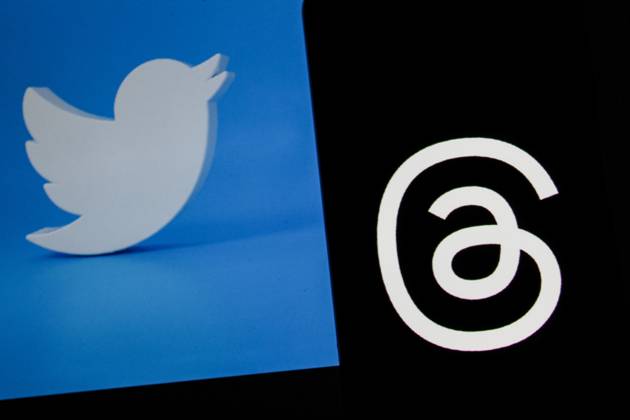 July 7, 2023, Bandung, West Java, Indonesia: In this photo illustration, Threads logo seen displayed on a smartphone and a Twitter logo in the background. Threads is the new social network from Meta Platforms which was launched on the 5th of July 2023. According to Meta CEO Mark Zuckerberg, the Threads app is designed to rival Twitter. As of 6th of July 2023, the Thread app already has 10 million users. Bandung Indonesia - ZUMAs281 20230707_zip_s281_017 Copyright: xAlgixFebrixSugitax