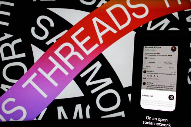 July 7, 2023, Bandung, West Java, Indonesia: In this photo illustration, Threads logo seen displayed on a smartphone and a threads logo in the background. Threads is the new social network from Meta Platforms which was launched on the 5th of July 2023. According to Meta CEO Mark Zuckerberg, the Threads app is designed to rival Twitter. As of 6th of July 2023, the Thread app already has 10 million users. Bandung Indonesia - ZUMAs281 20230707_zip_s281_018 Copyright: xAlgixFebrixSugitax