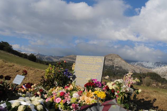 Germanwings A320 Crash Memorial Stele - Le Vernet Flowers lay at a memorial stele made of stone that reads In commemoration of the victims of the plane accident on 24 March 2015 in English, German, Spanish and French, on Easter Sunday in Le Vernet, France, April 5, 2015. Germanwings flight 4U 9525 crashed near near the village of La Vernet in the French Alps, southern France on 24 March 2015, carrying around 150 passengers and crew on board. Photo by Geoffroy Cournut ABACAPRESS.COM Le Vernet France  Copyright: xCournutxGeoffroy ABACAx 494945_004 CournutxGeoffroy ABACAx 494945_004