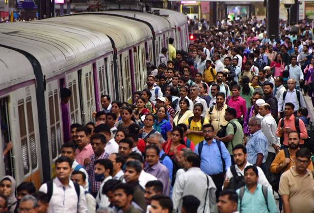 MUMBAI, INDIA - JULY 11: Commuters wait on a platform to board a local train, on World Population Day 2023, at CSMT, on July 11, 2023 in Mumbai, India. World Population Day is an annual event, observed on July 11 every year, which seeks to raise awareness of global population issues. The event was established by the Governing Council of the United Nations Development Programme in 1989. (Photo by Bhushan Koyande Hindustan Times ) World Population Day 2023
