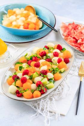 Summer light food. Cucumber and melon salad with raspberries and Prosciutto and pickled hot peppers Summer light food. Cucumber and melon salad with raspberries and Prosciutto and pickled hot peppers Copyright: xZoonar.com IngridxBalabanovax 20436668