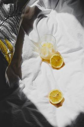 A closeup of a lemon juice with lemons on the bed *** einer closeupe des einer Zitrone Saft mit Zitronen am der Bett 4983755 RECORD DATE NOT STATED