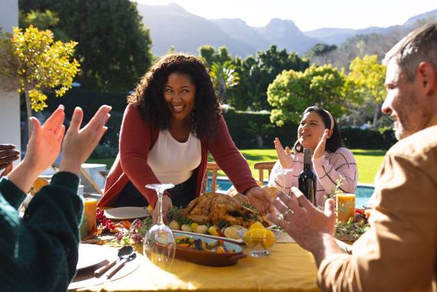 Happy diverse male and female friends serving thanksgiving celebration meal in sunny garden Happy diverse male and female friends serving thanksgiving celebration meal in sunny garden. Celebration, friendship, patriotism, american culture and tradition, unaltered., model released, , property released, Cape Town, South Africa, 07.09.2023, 4193335.jpg, people,happy,diverse,male and female,friend,serving,thanksgiving,celebration,meal,sunny,garden,friendship,patriotism,american culture,tradition,unaltered,holiday,patriotic,dinner,fun,nation,young,lunch,happiness,together,beautiful,spring,summer,party,food,traditional,season,christmas,cheerful,decoration,flag,male,female,american,culture Mid Adult,Woman,Female,African American,Mature Adult,Man,