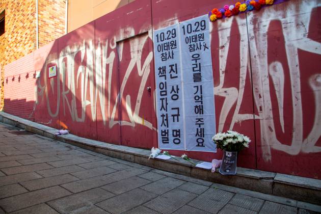 Itaewon tragedy, Oct 29, 2023 : Flowers are seen in alleyway, the site of the Itaewon crowd crush during Halloween celebrations last year, in Seoul, South Korea. Thousands of people and family members of the victims gathered in central Seoul on Sunday to cherish the memories of the deceased at a memorial event marking the first anniversary of the deadly Itaewon crowd crush that claimed 159 lives. They demanded a probe into the disaster and punishment of officials found responsible for the tragedy. Placards read, Investigate and punish officials found responsible for the October 29 Itaewon disaster (L) and Remember us . , aflo_234061658.jpg,
