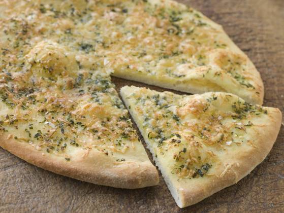 IMAGO Creative, Food, Brot, Knoblauchbrot Close up of Garlic Pizza Bread , 541873.jpg, Baked, Bread, Butter, Pizza, Pizza Bread, Snack, Garlic, Garlic Bread, Cheese, Close Up, Color Image, Detail View, Food, Food and Drink Series, Hard Cheese, Horizontal, Italian, No People, Oregano, Parmesan Cheese, Parsley, Photography, Studio Shot, Yeast, RECORD DATE NOT STATED