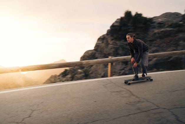 Man skateboarding near railing on road at sunset Spain, Mallorca, model released Copyright: xMaskotx , MA104895 MA104895
