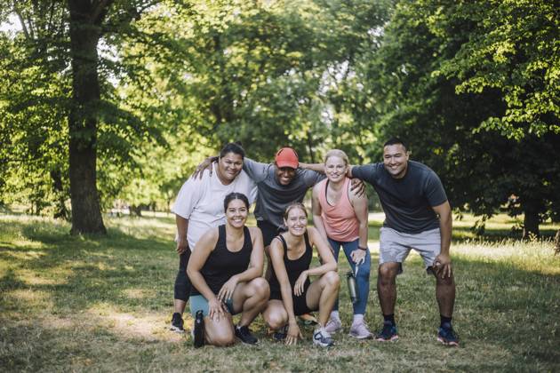 Portrait of happy multiracial male and female friends posing after training session at park Sweden, Stockholm, model released Copyright: xMaskotx , MA105069 MA105069