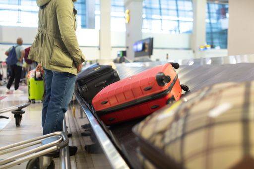 The luggage belt with suitcases being delivered to the passengers at the arrival terminal 22226012 RECORD DATE NOT STATED