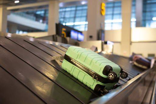 The luggage belt with suitcases being delivered to the passengers at the arrival terminal 22226013 RECORD DATE NOT STATED