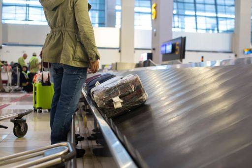 The luggage belt with suitcases being delivered to the passengers at the arrival terminal 22226015 RECORD DATE NOT STATED