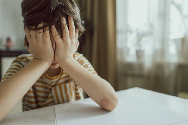 Sad boy covering face with hands at home model released, Symbolfoto property released, ANAF02482