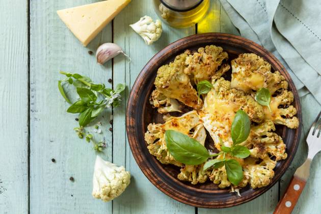 Healthy eating, plant based meat substitute concept.Vegetarian organic food. Baked cauliflower steaks with herbs and spices on a wooden table. View from above. Healthy eating, plant based meat substitute concept.Vegetarian organic food. Baked cauliflower steaks with herbs and spices on a wooden table. View from above. Copyright: xZoonar.com ELENAxHRAMOVAx 20741070