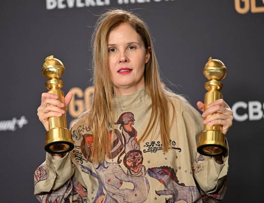 Justine Triet appears backstage after winning the award for Best Screenplay, Motion Picture award for Anatomy of a Fall during the 81st annual Golden Globe Awards at the Beverly Hilton in Beverly Hills, California on Sunday, January 7, 2024.  LAP202401070144 CHRISxCHEW