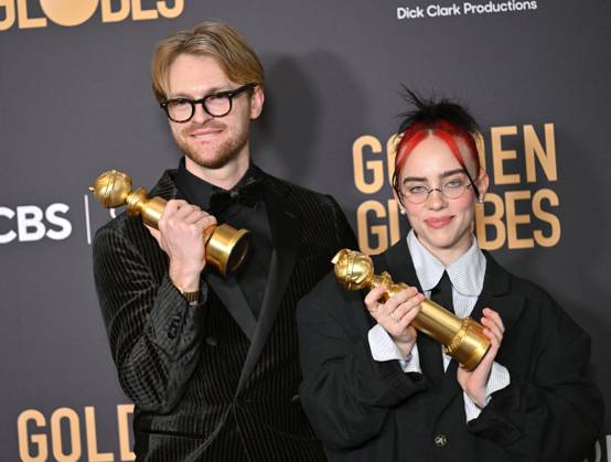 (L-R) FINNEAS and Billie Eilish appear backstage after winning the award for the Best Original Song, Motion Picture award for Barbie ? What Was I Made For? during the 81st annual Golden Globe Awards at the Beverly Hilton in Beverly Hills, California on Sunday, January 7, 2024.  LAP202401070308 CHRISxCHEW