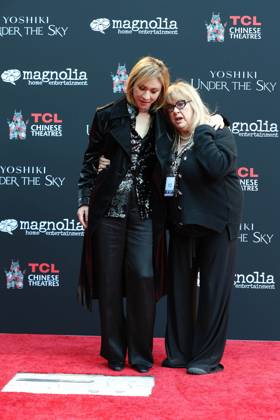 January 9, 2024, Los Angeles, California, Usa: LOS ANGELES, CA - JAN 9, 2024: Yoshiki, Colleen Camp at a special ceremony to unveil Yoshikiâ€⠢s newly-inground handprints and footprints held at the TCL Chinese Theatre IMAX. Los Angeles Usa - ZUMAg107 20240109_zep_g107_046 Copyright: xNinaxPrommerx