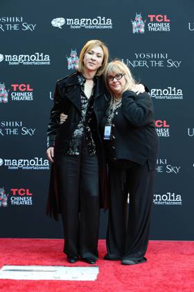 January 9, 2024, Los Angeles, California, Usa: LOS ANGELES, CA - JAN 9, 2024: Yoshiki, Colleen Camp at a special ceremony to unveil Yoshikiâ€⠢s newly-inground handprints and footprints held at the TCL Chinese Theatre IMAX. Los Angeles Usa - ZUMAg107 20240109_zep_g107_047 Copyright: xNinaxPrommerx