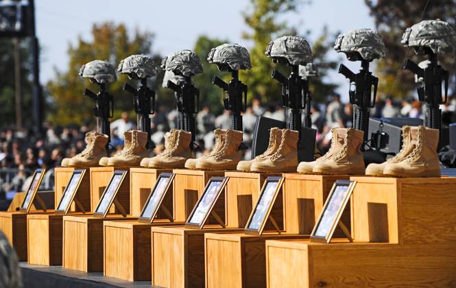 Memorial service for 13 killed and 30 wounded at Fort Hood shooting Fort Hood, TX - November 10, 2009 -- The Soldiers Cross, boots, rifles and helmets, sit on the podium at the memorial service for the 12 soldiers and one civilian killed at Fort Hood U.S Army Post near Killeen, Texas, USA 10 November 2009. Army Major Malik Nadal Hasan reportedly shot and killed 13 people, 12 soldiers and one civilian, and wounded 30 others in a rampage 05 November at the base s Soldier Readiness Center where deploying and returning soldiers undergo medical screenings. .Credit: Tannen Maury Pool via CNP Fort Hood Texas United States of America EDITORIAL USE ONLY Copyright: xx THM03P epa01928211 TannenxMauryx cnpphotos021508