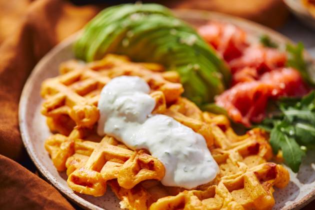 Hearty sweet potato or pumpkin waffles with avocado, salmon, arugula and sauce Hearty sweet potato or pumpkin waffles with avocado, salmon, arugula and sauce Copyright: xZoonar.com BurakovaxIrinax 21030493