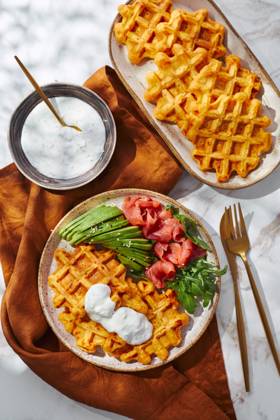 Hearty sweet potato or pumpkin waffles with avocado, salmon, arugula and sauce Hearty sweet potato or pumpkin waffles with avocado, salmon, arugula and sauce Copyright: xZoonar.com BurakovaxIrinax 21068410