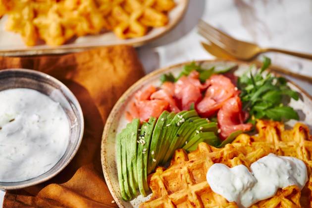 Hearty sweet potato or pumpkin waffles with avocado, salmon, arugula and sauce Hearty sweet potato or pumpkin waffles with avocado, salmon, arugula and sauce Copyright: xZoonar.com BurakovaxIrinax 21068435