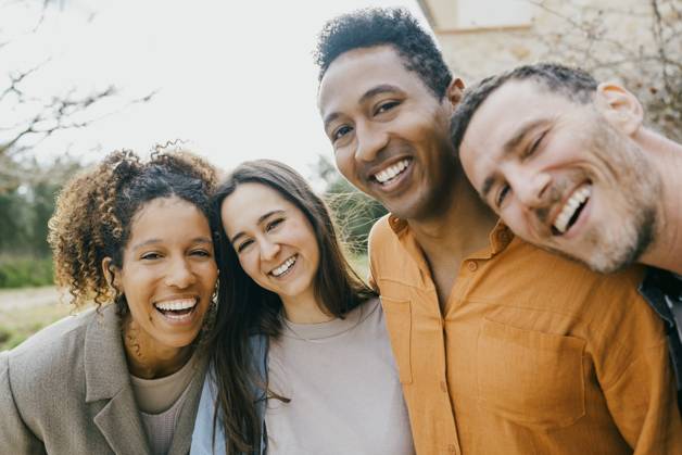 Portrait of happy multiracial male and female friends at backyard Spain, Mallorca, model released Copyright: xMaskotx , MA107174 MA107174