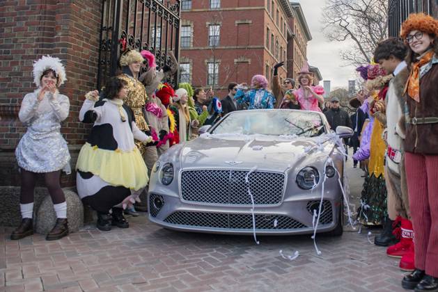 US actress Annette Bening, flanked by Harvard students, waves to the crowd during a parade, through the Harvard Yard in her honor, as she is named the Harvard University s Hasty Pudding Theatricals 2024 Woman of the Year in Cambridge, MA on Tuesday, February 06, 2024.  BOS20240206017 AmandaxSabga