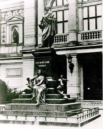 View of the Mendelssohn statue in front of the Gewandhaus in Leipzig (b w photo) XJF264731 View of the Mendelssohn statue in front of the Gewandhaus in Leipzig (b w photo) by English Photographer, (20th century); Private Collection; (add.info.: made by Werner Stein; unveiled 26th May 1892; demolished by Nazis on 9th 10th Novermber 1936 & later melted down; Felix (1809-47); German composer;). Copyright: xBridgemanxImagesx 264731