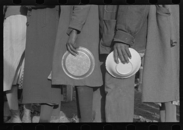 African Americans in the lineup for food at mealtime in the camp for flood refugees, Forrest City, Arkansas, 1937 (b w photo) 3666435 African Americans in the lineup for food at mealtime in the camp for flood refugees, Forrest City, Arkansas, 1937 (b w photo) by Evans, Walker (1903-75); Private Collection; (add.info.: Photograph taken for the U.S. Resettlement Administration: a New Deal U.S. federal agency that, between April 1935 and December 1936, relocated struggling urban and rural families to communities planned by the federal government.). Copyright: xBridgemanxImagesx 3666435