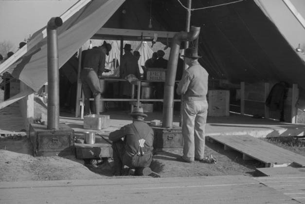 The kitchen in the camp for white flood refugees at Forrest City, Arkansas, 1937 (b w photo) 3666440 The kitchen in the camp for white flood refugees at Forrest City, Arkansas, 1937 (b w photo) by Evans, Walker (1903-75); Private Collection; (add.info.: Photograph taken for the U.S. Resettlement Administration: a New Deal U.S. federal agency that, between April 1935 and December 1936, relocated struggling urban and rural families to communities planned by the federal government. ). Copyright: xBridgemanxImagesx 3666440