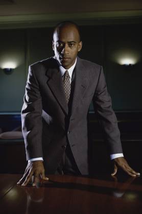 Portrait of a young businessman standing in his office Copyright: xx 1574R-0873B