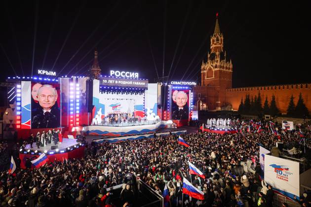 Bilder des Jahres 2024, News 03 MÃ¤rz News Themen der Woche KW12 News Bilder des Tages RUSSIA, MOSCOW - MARCH 18, 2024: President-elect Vladimir Putin (on video screens) attends a rally and concert in Red Square marking the 10th anniversary of the reunification of Crimea and Russia. Russian Presidential Press and Information Office Gavriil Grigorov TASS  68329072