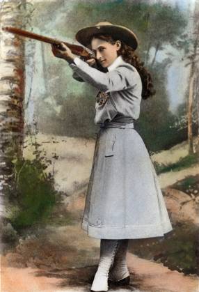 ANNIE OAKLEY (1860-1926). American markswoman. Oil over a photograph, 1899.  Copyright: xSarinxImagesx xGRANGERx 0052842