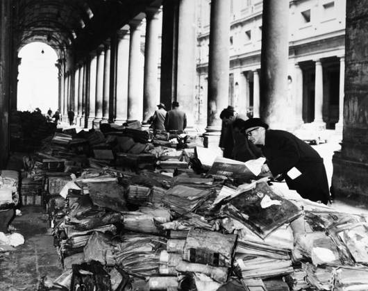 FLORENCE: FLOOD, 1966. Books and manuscripts from the Florence State Archives damaged during the flood of the Arno River, piled in front of the Uffizi Gallery. Photograph 21 November 1966.  Copyright: xGRANGERx xGRANGERx 0124015