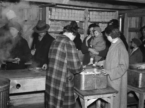 FLOOD REFUGEES, 1937. Flood refugees being fed at Tent City, near Shawneetown, Illinois. Photograph by Walker Evans, April 1937.  Copyright: xGRANGERx xGRANGERx 0323292