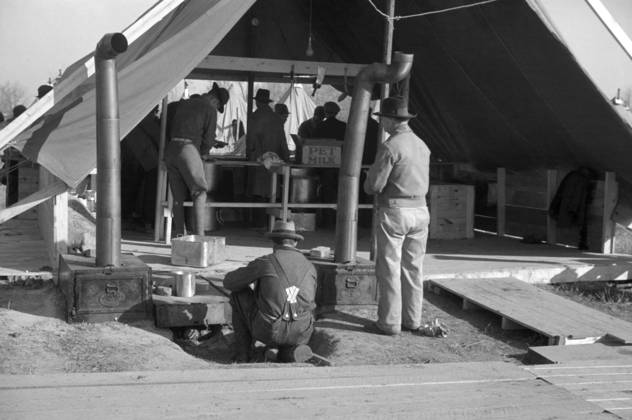 FLOOD REFUGEES, 1937. The kitchen tent at a flood refugee camp in Forrest City, Arkansas. Photograph by Walker Evans, February 1937.  Copyright: xGRANGERx xGRANGERx 0325856