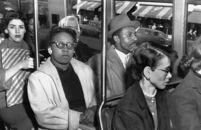 DESEGREGATION: ALABAMA. African American anti-segregation activists, including Reverend Frederick Shuttlesworth, sit alongside white passengers on a bus in Birmingham, Alabama. Photograph, 1956.  Copyright: xGRANGERx xGRANGERx 0621849