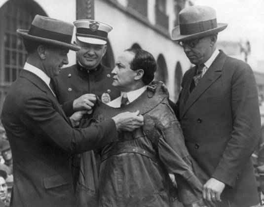 HARRY HOUDINI (1874-1926). American magician. Houdini secured into a strait jacket for an escape. Photograph, c1920.  Copyright: xGRANGERx xGRANGERx 0651403