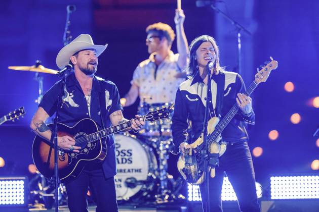 April 5, 2024, Austin, Tx, United States: American country rock band NEEDTOBREATHE with lead singer BEAR RINEHART performs at a taping of CMT Country Crossroads in front of the University of Texas Tower on April 5, 2024. At right is bassist SETH BOLT Austin United States - ZUMAd150 20240405_znp_d150_019 Copyright: xBobxDaemmrichx