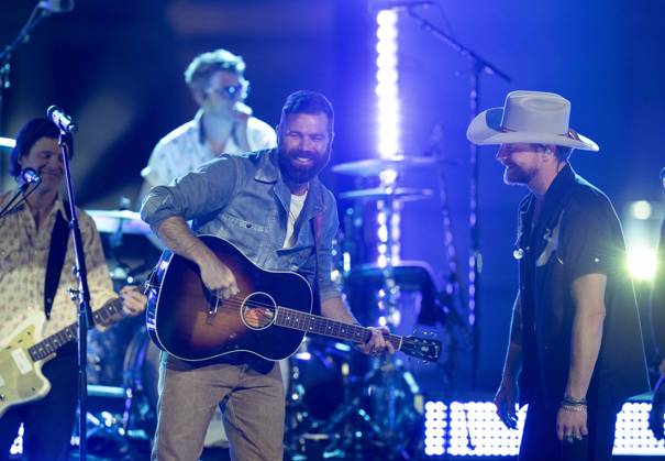 April 5, 2024, Austin, Tx, United States: American country rock band NEEDTOBREATHE with lead singer BEAR RINEHART, r, teams up with country pop singer JORDAN DAVIS performs at a taping of CMT Country Crossroads in front of the University of Texas Tower on April 5, 2024. Austin United States - ZUMAd150 20240405_znp_d150_022 Copyright: xBobxDaemmrichx