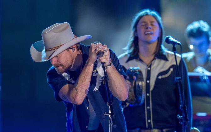 April 5, 2024, Austin, Tx, United States: American country rock band NEEDTOBREATHE with lead singer BEAR RINEHART performs at a taping of CMT Country Crossroads in front of the University of Texas Tower on April 5, 2024. At right is bassist SETH BOLT Austin United States - ZUMAd150 20240405_znp_d150_025 Copyright: xBobxDaemmrichx