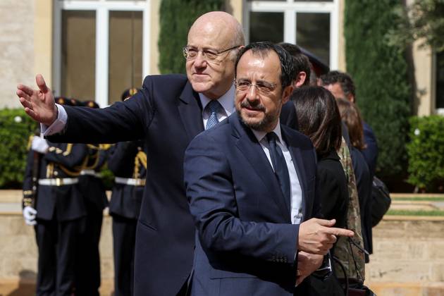 April 8, 2024, Beirut, Beirut, Lebanon: Lebanese Prime Minister NAJIB MIKATI (L) shows the way to Cypriot President NIKOS CHRISTODOULIDES upon his arrival at Beirut governmental Palace. Christodoulides arrived in Beirut for talks with officials for possible solutions for the incessant flow of displaced Syrians to the island from the Lebanese coast. Beirut Lebanon - ZUMAn313 20240408_zip_n313_003 Copyright: xMarwanxNaamanix