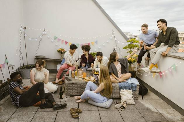 Group of multiracial friends having fun while celebrating during party in decorated balcony Germany, Berlin, model released, property released Copyright: xMaskotx , MA108152 MA108152