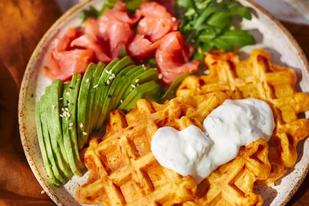 Hearty sweet potato or pumpkin waffles with avocado, salmon, arugula and sauce Hearty sweet potato or pumpkin waffles with avocado, salmon, arugula and sauce Copyright: xZoonar.com BurakovaxIrinax 21206851