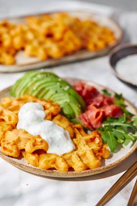 Hearty sweet potato or pumpkin waffles with avocado, salmon, arugula and sauce Hearty sweet potato or pumpkin waffles with avocado, salmon, arugula and sauce Copyright: xZoonar.com BurakovaxIrinax 21207085