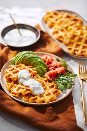 Hearty sweet potato or pumpkin waffles with avocado, salmon, arugula and sauce Hearty sweet potato or pumpkin waffles with avocado, salmon, arugula and sauce Copyright: xZoonar.com BurakovaxIrinax 21220572