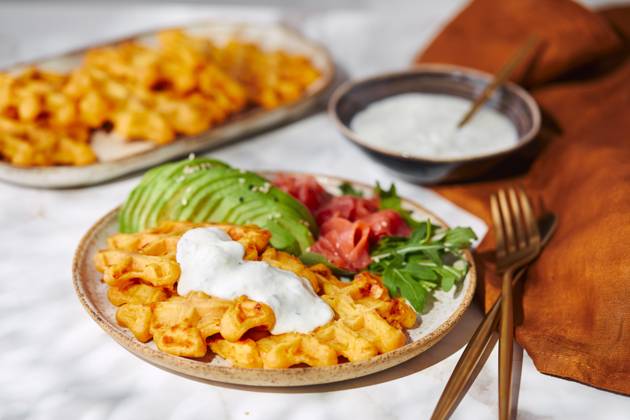 Hearty sweet potato or pumpkin waffles with avocado, salmon, arugula and sauce Hearty sweet potato or pumpkin waffles with avocado, salmon, arugula and sauce Copyright: xZoonar.com BurakovaxIrinax 21220609