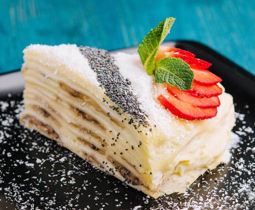 IMAGO Creative: Food, Mohn Pancake cake with pieces of strawberries, coconut and poppy seeds and sour cream Pancake cake with pieces of strawberries, coconut and poppy seeds and sour cream Copyright: xZoonar.com AntonxDobreax 21374254