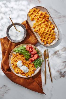 Hearty sweet potato or pumpkin waffles with avocado, salmon, arugula and sauce Hearty sweet potato or pumpkin waffles with avocado, salmon, arugula and sauce Copyright: xZoonar.com BurakovaxIrinax 21517995